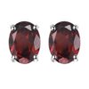 Garnet oval stud earrings in silver prong setting