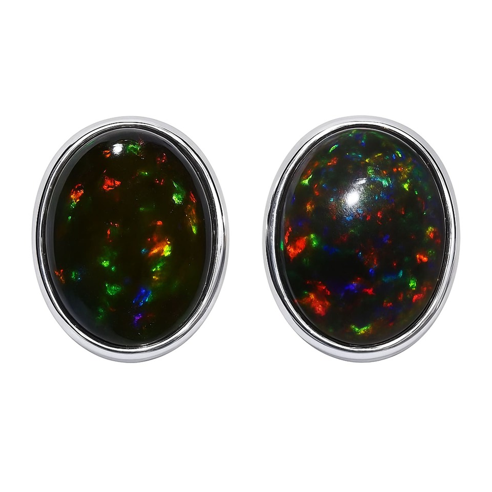 Oval black opal stud earrings with vibrant multicolor flashes, set in a smooth silver bezel.