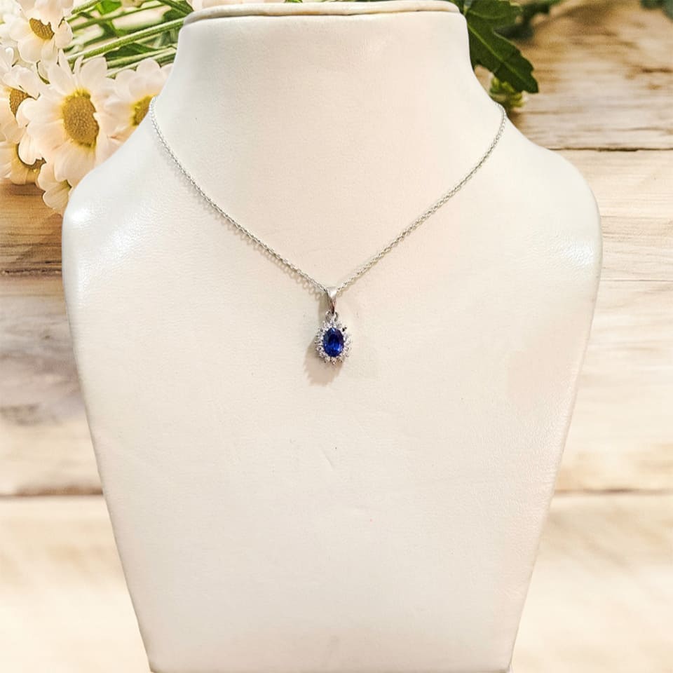 Blue sapphire pendant necklace on display bust