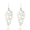 Textured silver dangle earrings with abstract circular cutouts