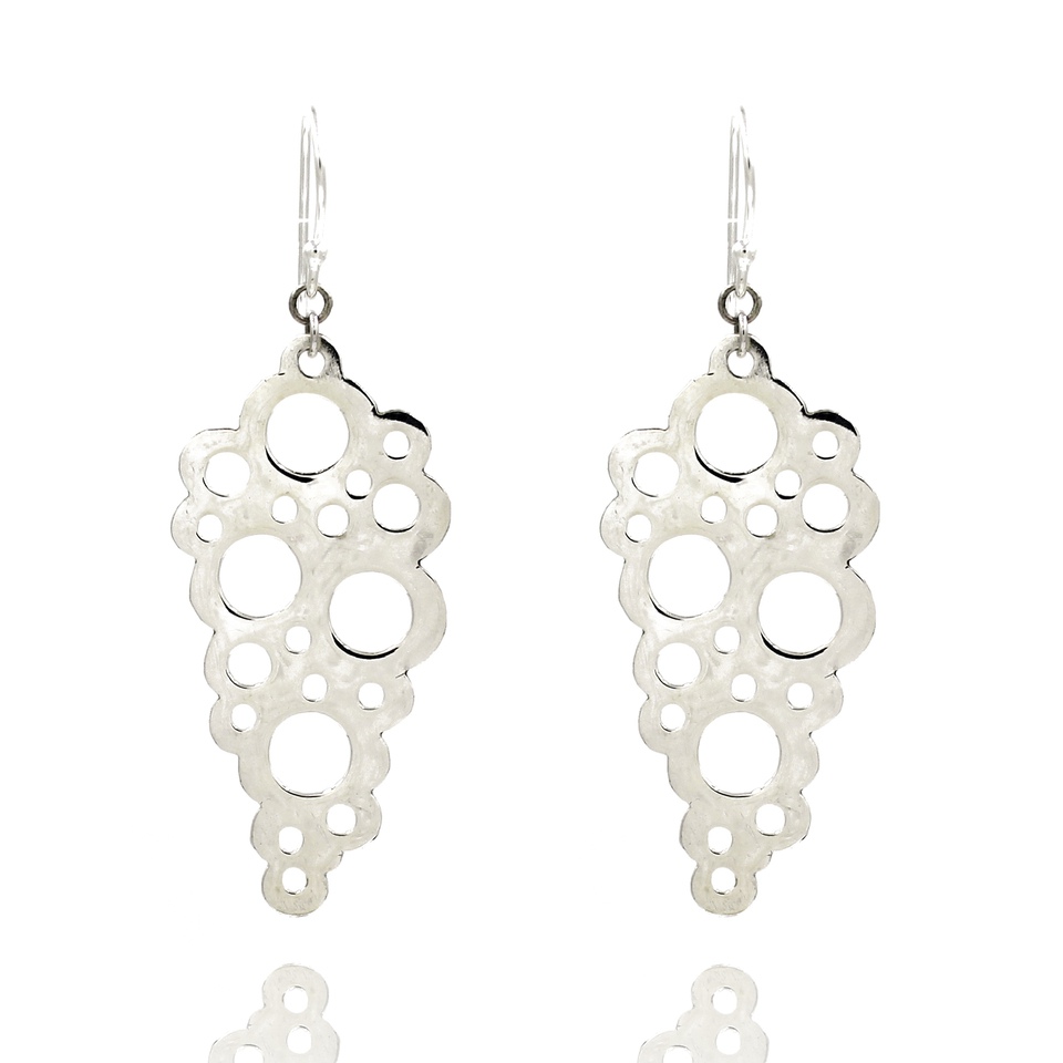 Textured silver dangle earrings with abstract circular cutouts