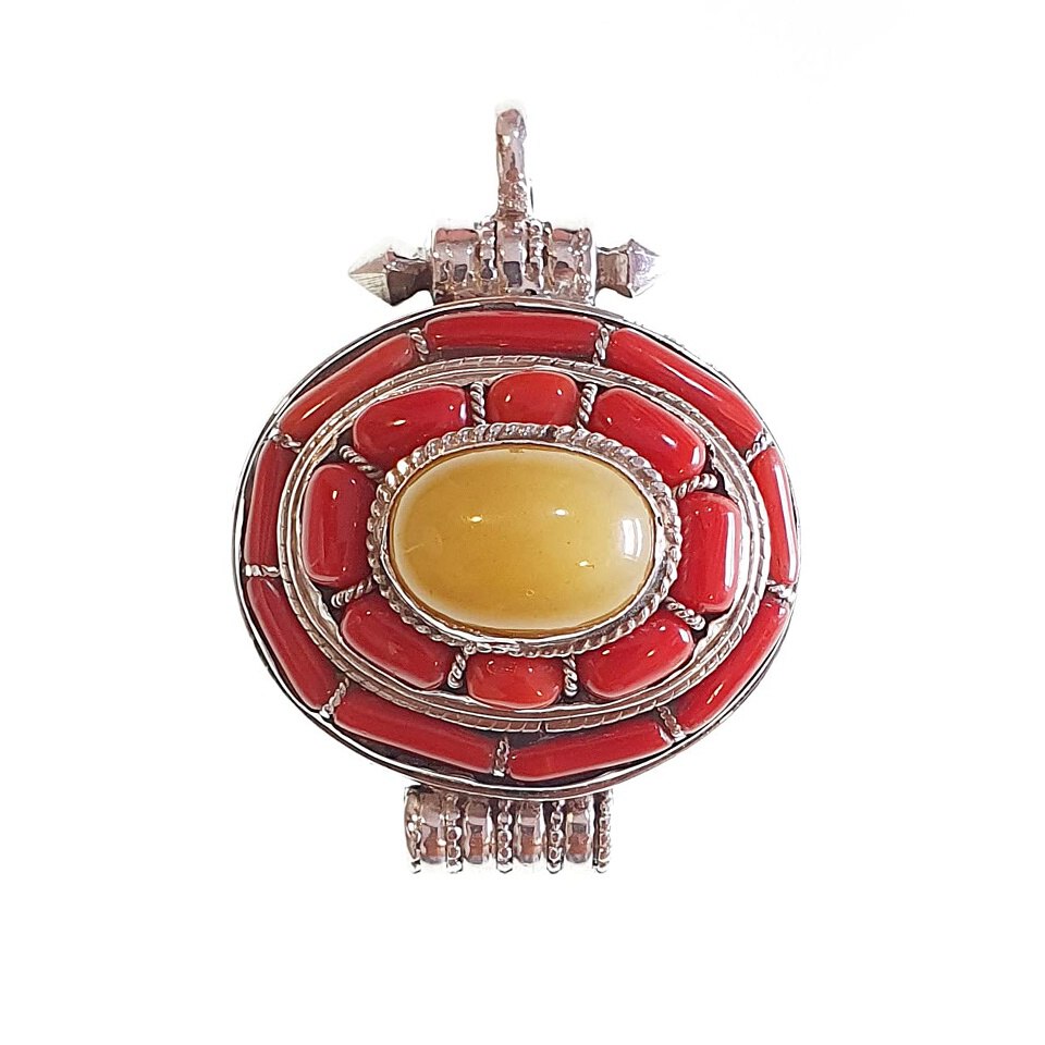 Tibetan oval pendant with central amber stone and coral inlay