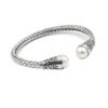 Textured sterling silver cuff bracelet with dual white pearl ends and oxidized accents
