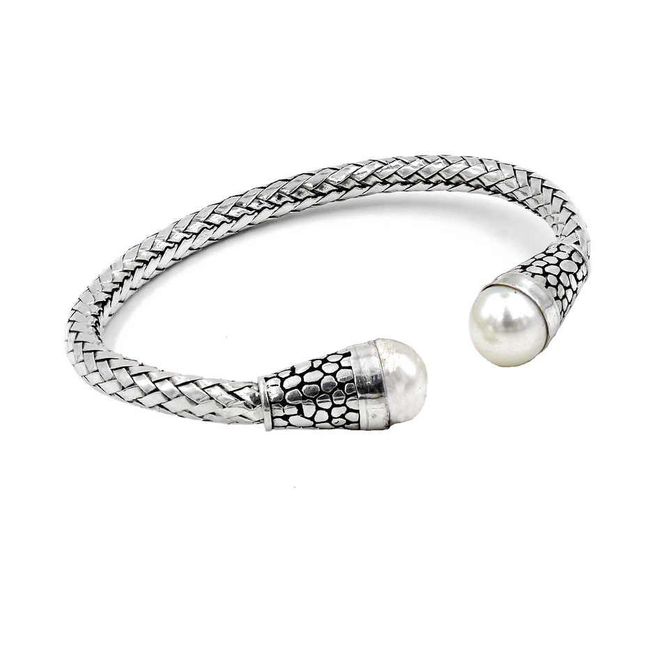 Textured sterling silver cuff bracelet with dual white pearl ends and oxidized accents
