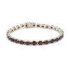 925 sterling silver tennis bracelet with oval-cut garnet gemstones