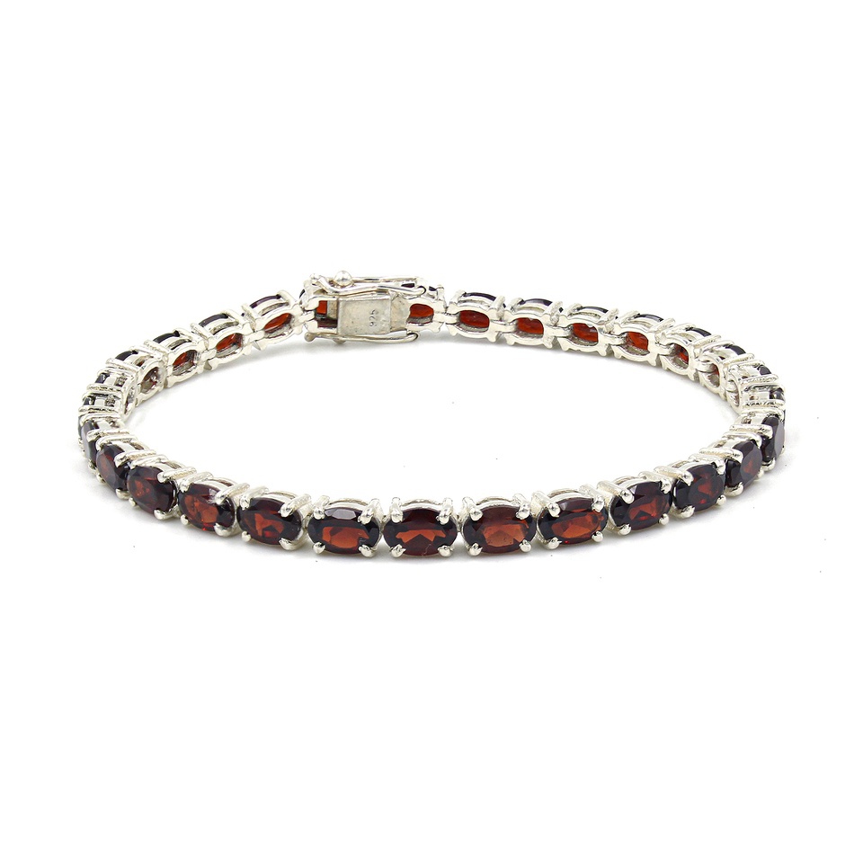 925 sterling silver tennis bracelet with oval-cut garnet gemstones