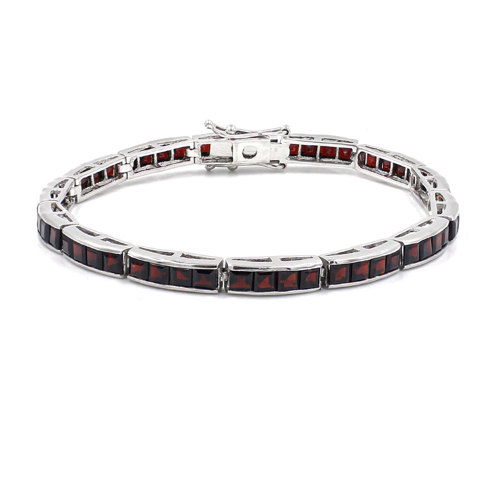 925 sterling silver garnet tennis bracelet with a secure box clasp closure