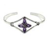 Silver cuff bracelet with marquise-cut amethyst gemstones arranged in a floral design