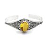 Sterling silver cuff with oval faceted yellow citrine gemstone