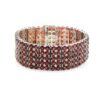 Wide 925 sterling silver bracelet with multiple rows of round-cut garnet gemstones