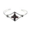 Silver cuff bracelet with marquise-shaped garnet gemstones in a floral design