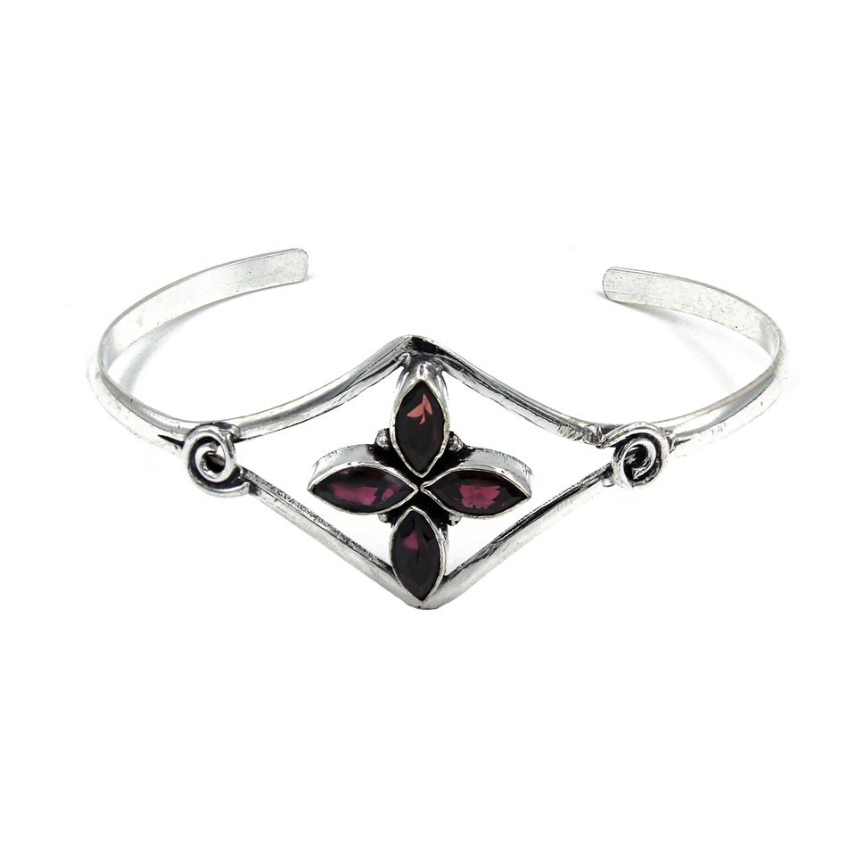 Silver cuff bracelet with marquise-shaped garnet gemstones in a floral design