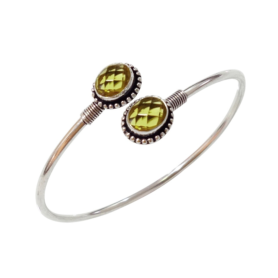 Silver cuff bracelet with dual oval faceted citrine gemstones