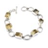Sterling silver bracelet with cushion-cut lemon quartz gemstones in bezel settings