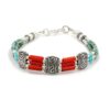 Handmade Tibetan silver bracelet with turquoise beads and coral tubes.