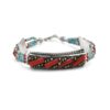 Handmade Tibetan silver bracelet with coral tubes and turquoise beads.