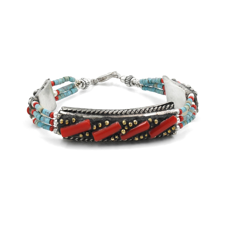 Handmade Tibetan silver bracelet with coral tubes and turquoise beads.