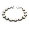 Pearl bracelet with ornate sterling silver links
