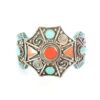 Tibetan silver bracelet with turquoise and coral inlay in an ornate star design