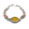 Sterling silver bracelet with oval yellow amber center and red coral accents