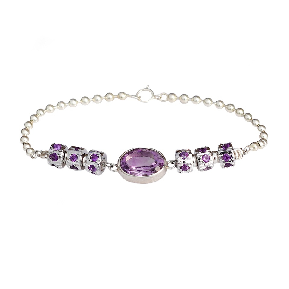 Silver beaded bracelet with oval purple amethyst and charm spacers