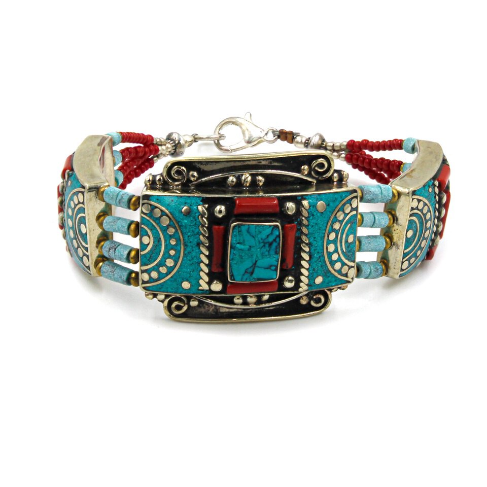 Ethnic bracelet with turquoise and coral inlay, ornate silver detailing