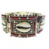 Tibetan silver bracelet with cowrie shell and red coral accents