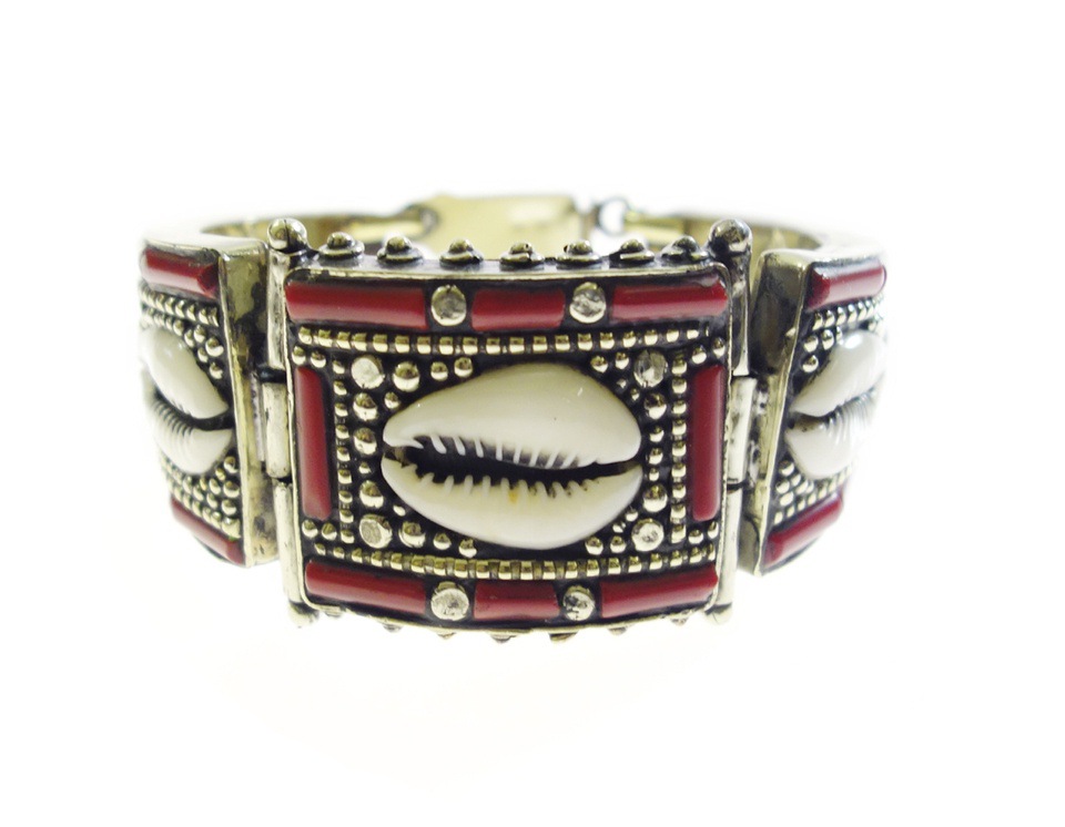 Tibetan silver bracelet with cowrie shell and red coral accents