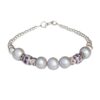 White pearl bracelet with gemstone-studded silver spacers and a silver beaded chain