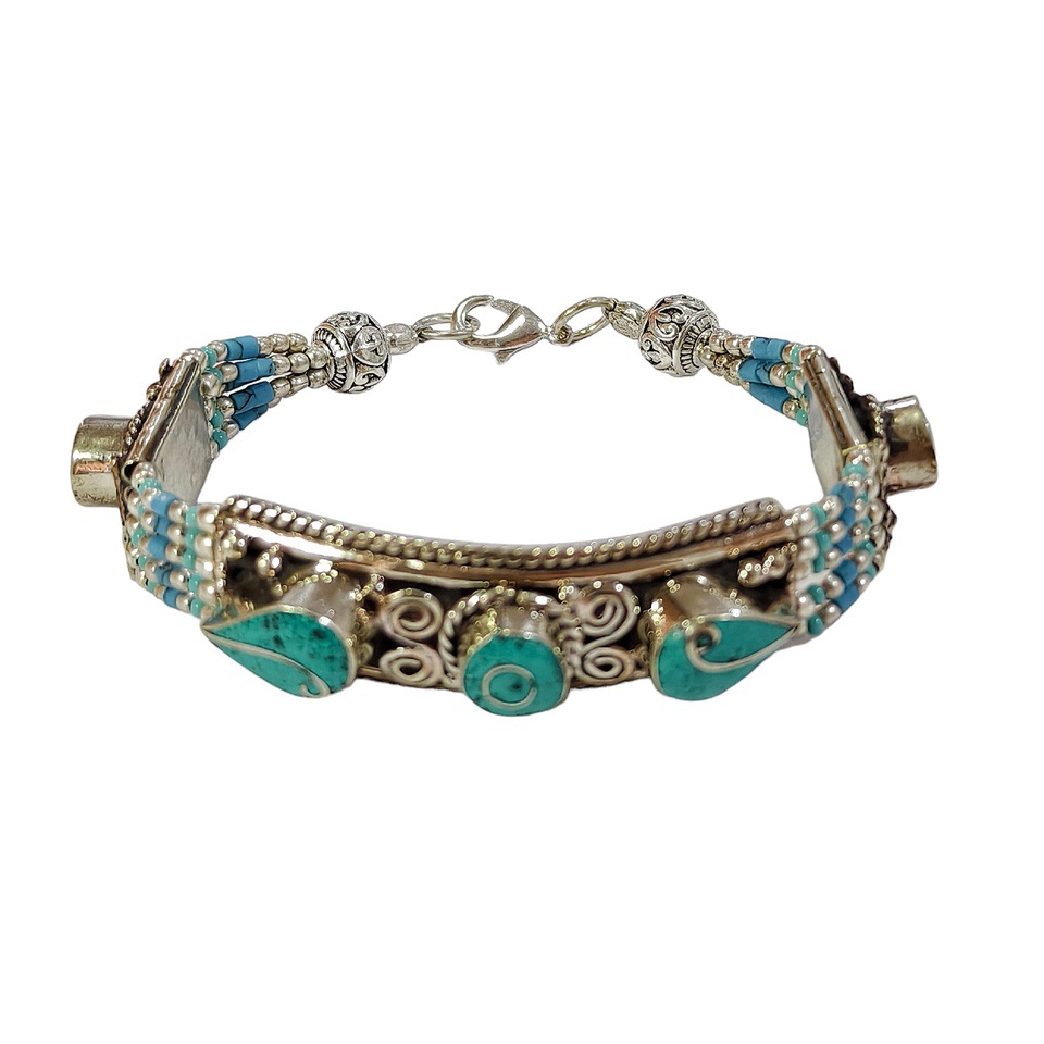 Handmade Tibetan silver bracelet with turquoise inlay.