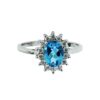 Sterling silver halo ring with Blue Topaz and white stones