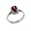 Sterling silver ring with rectangular-cut Garnet gemstone and a halo of sparkling white stones