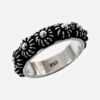 925 sterling silver floral ring with oxidized finish and raised daisy motifs