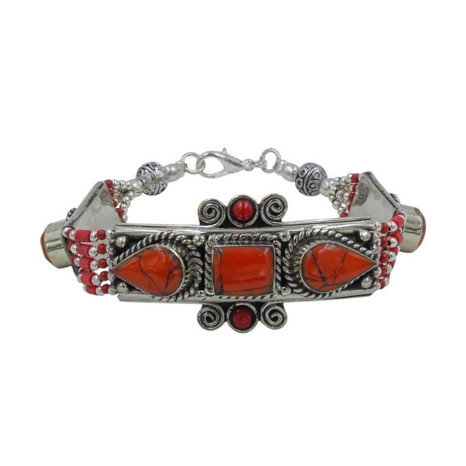 Red coral inlay tribal bracelet with silver detailing