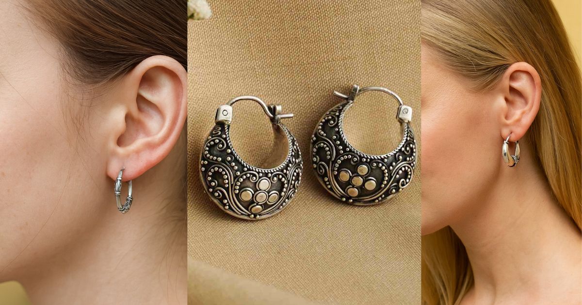 Sterling silver hoop earrings on a woman’s ear.
