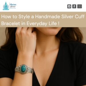 Woman wearing handmade silver cuff bracelet with turquoise stone