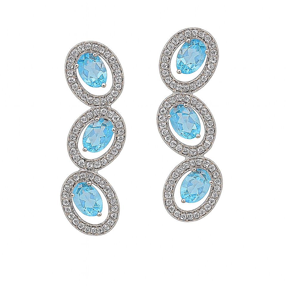 Silver oval drop earrings with blue topaz gemstones.