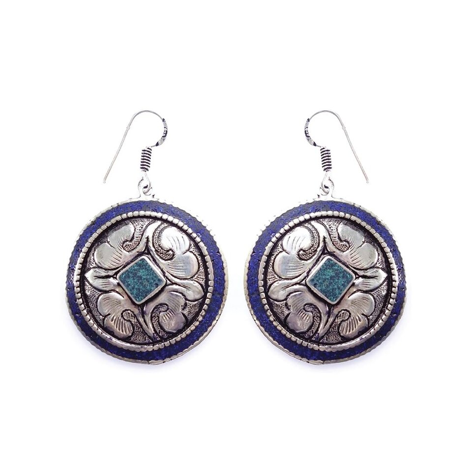 Round Tibetan earrings with turquoise inlay and silver floral design.