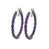 Silver hoop earrings with amethyst gemstones.