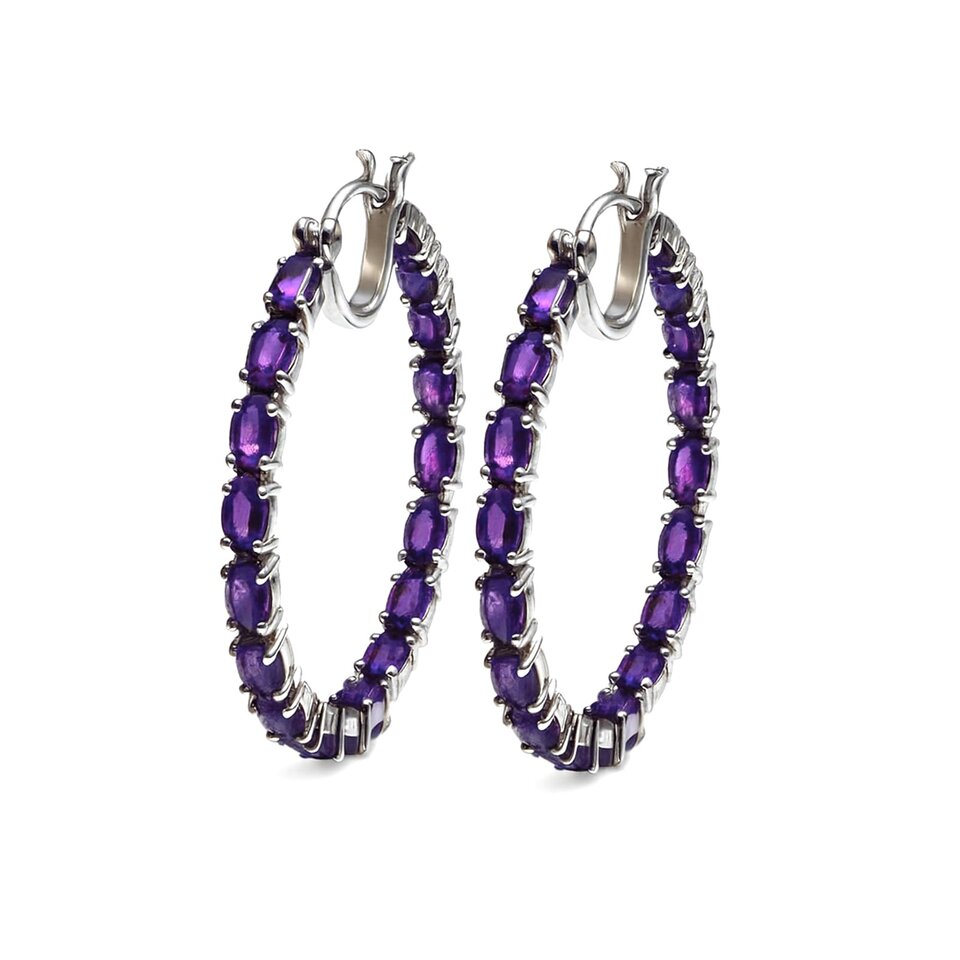 Silver hoop earrings with amethyst gemstones.