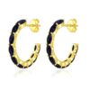 Gold hoop earrings with black onyx gemstones.