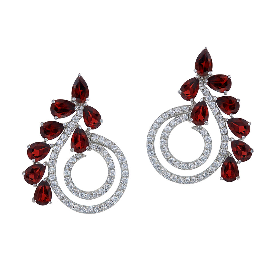 Silver spiral earrings with garnet gemstones.