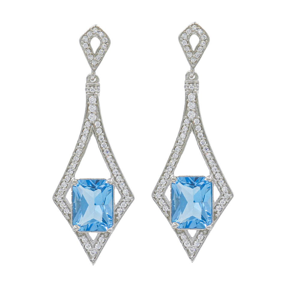 Silver drop earrings with blue topaz gemstones.