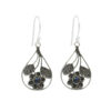 Silver floral dangle earrings with black opal gemstone.