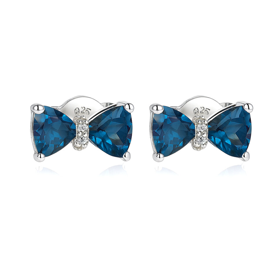 Silver bow stud earrings with blue topaz.