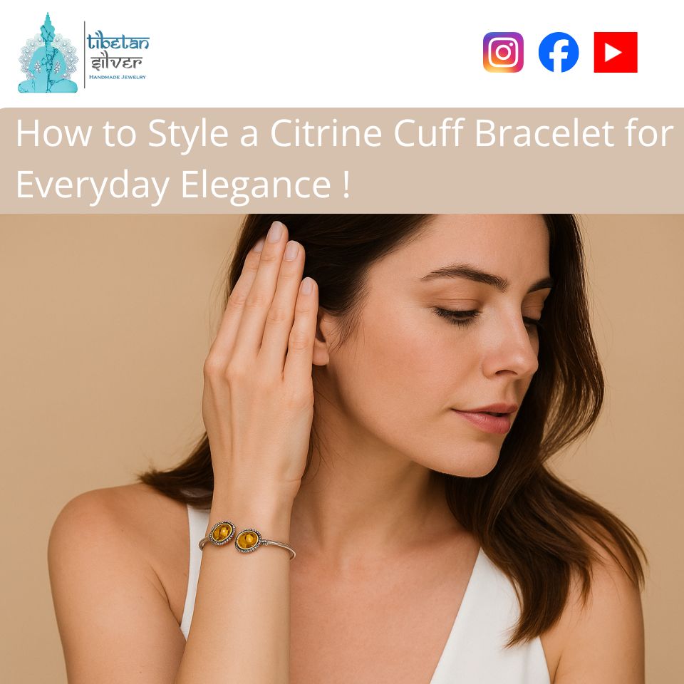 Woman wearing a silver citrine cuff bracelet with dual oval citrine stones.